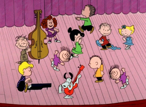 Scene from Charlie Brown Christmas with characters dancing on stage