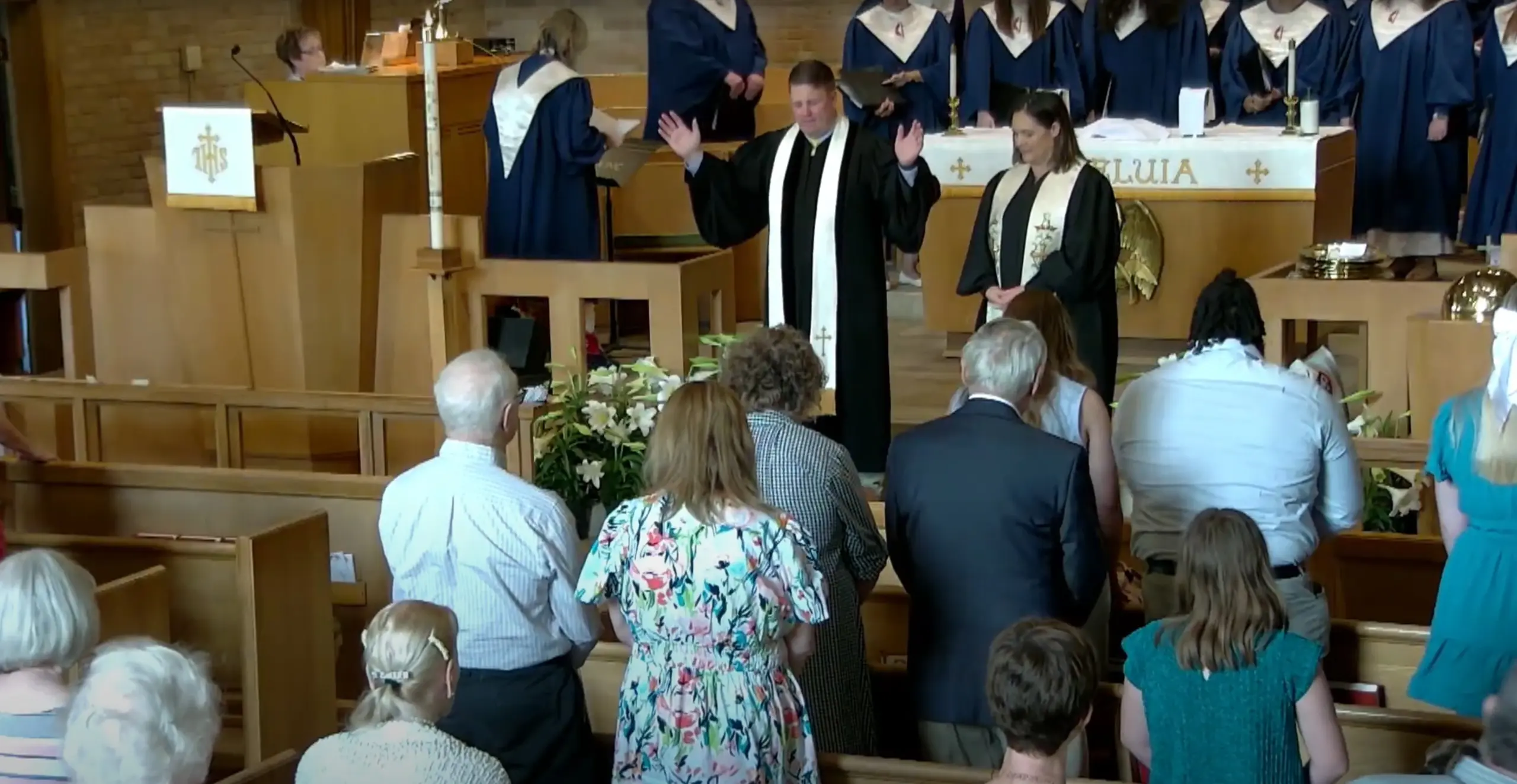Congregation bows as Pastors Jonathan and Stephanie pray